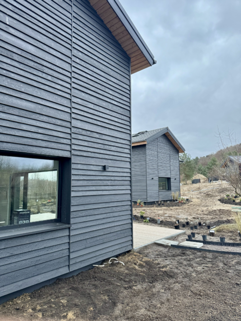 domy elewacja drewniana pozioma tarasy drewniane Latzke